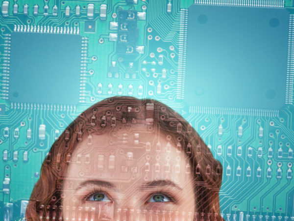 Cropped image of beautiful woman looking up against printed circuit board