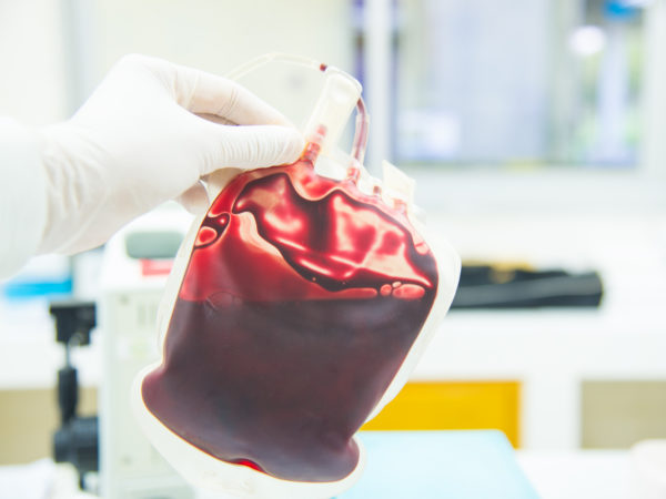 Red Bag of Blood in hand Doctor